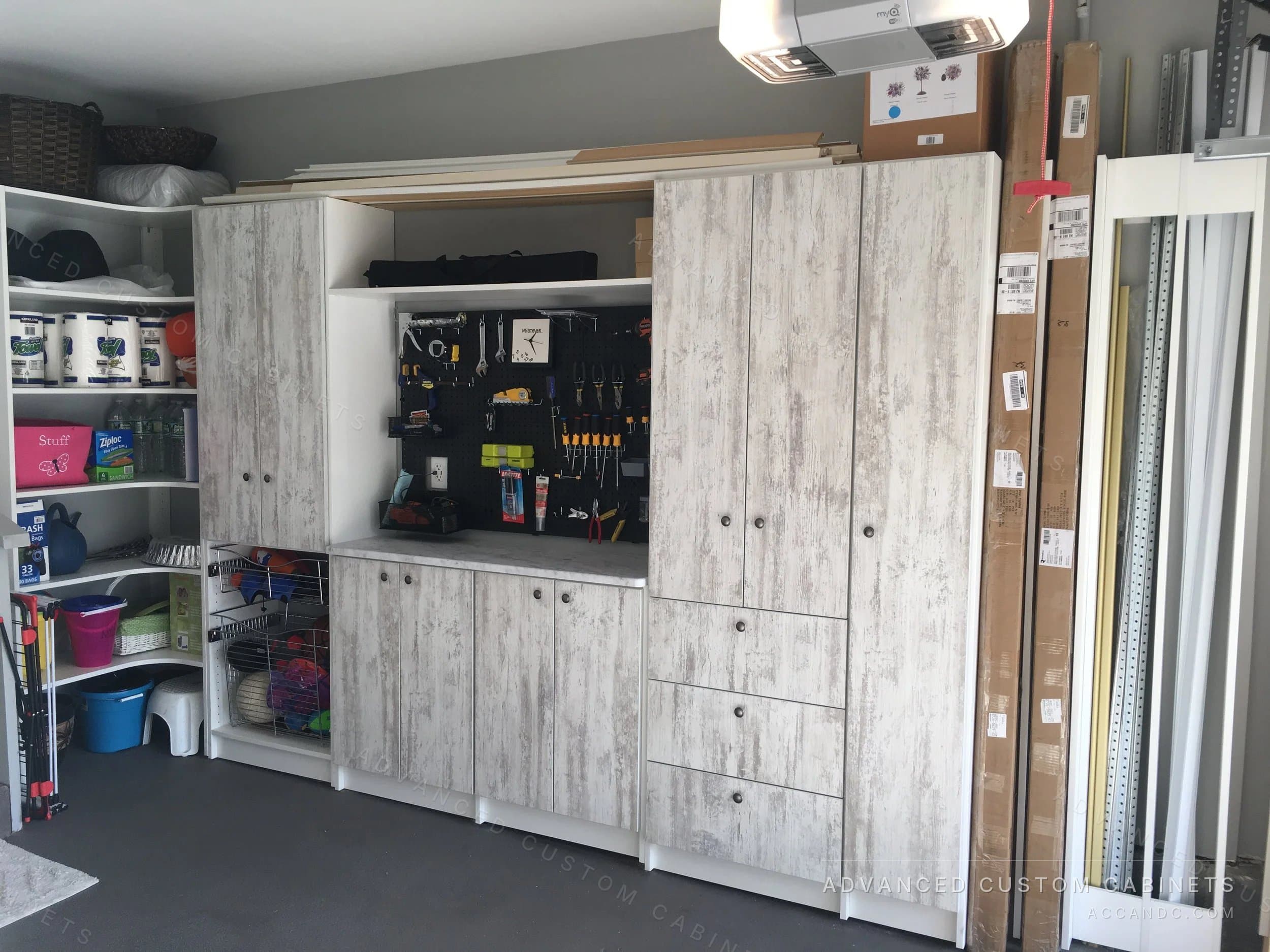 Garage cabinets with pegboard tool wall