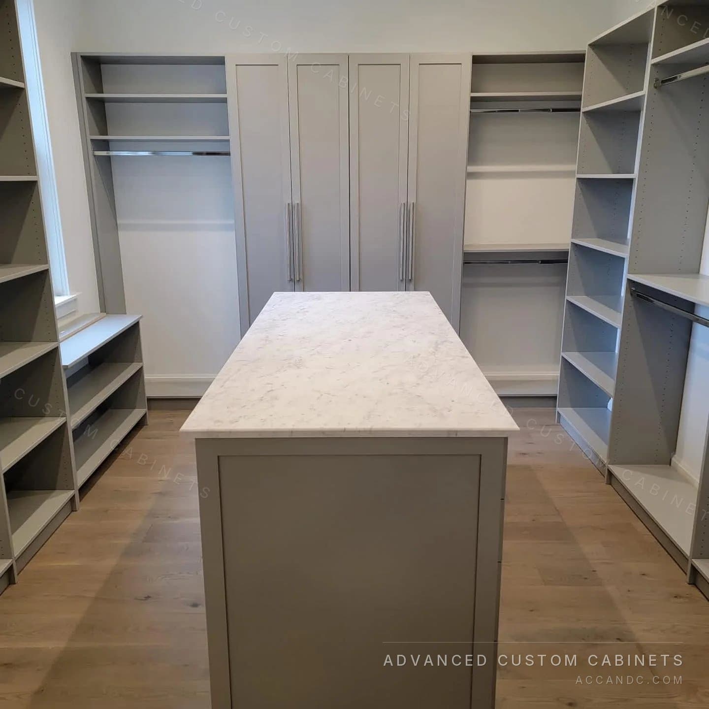 Custom wardrobe wall with marble-top island