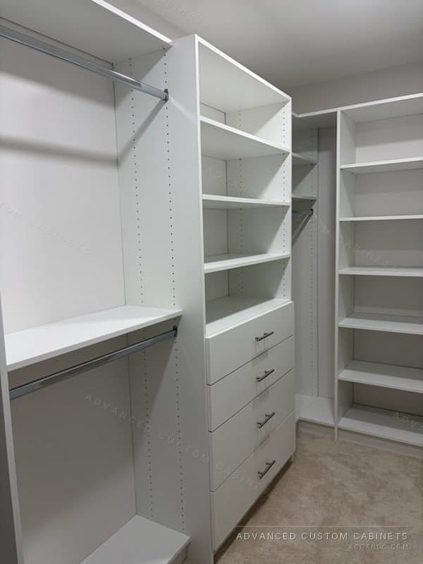 White walk-in closet system with open shelves, drawers and hanging rods