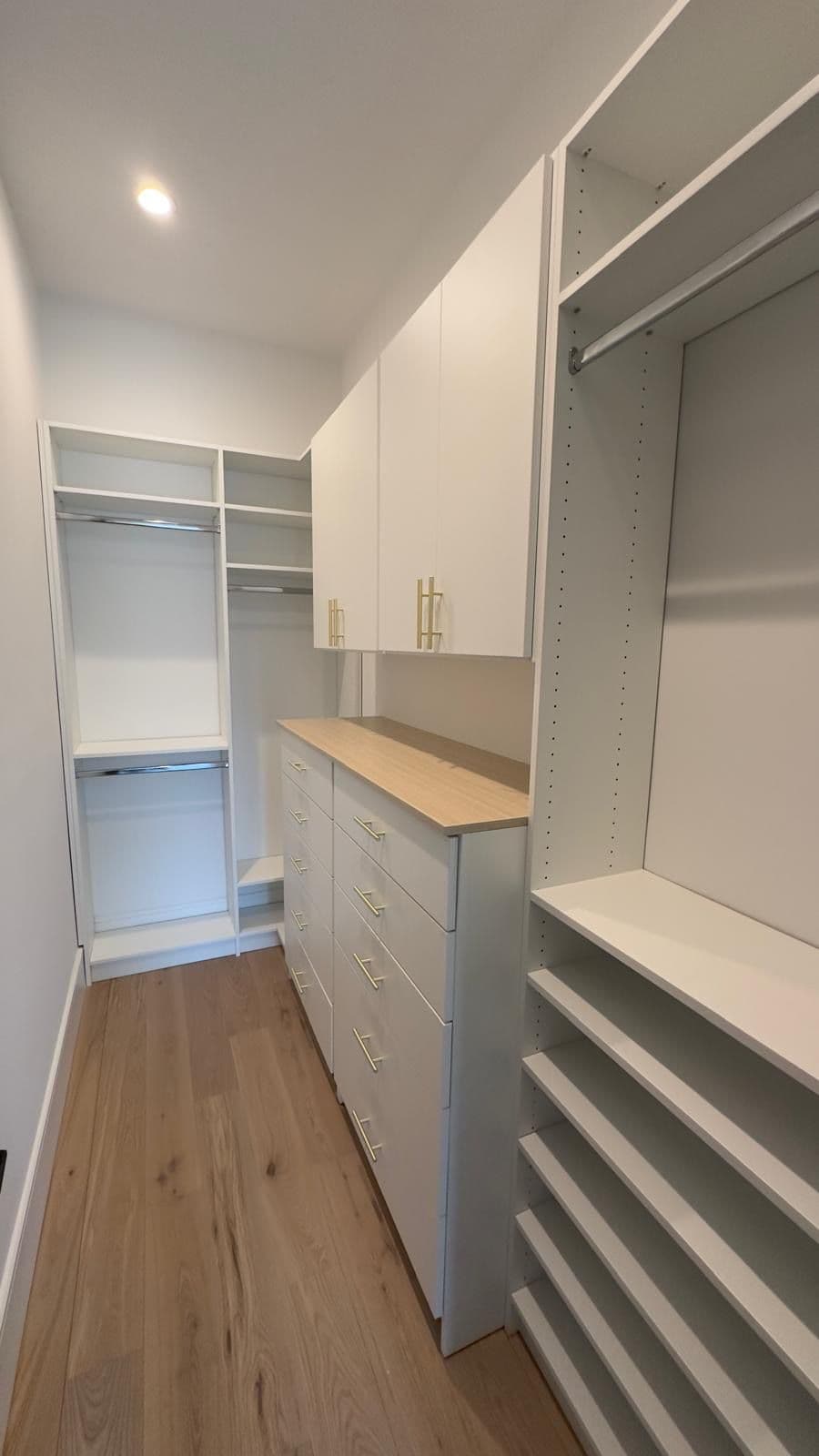 Custom walk-in closet by Advanced Custom Cabinets