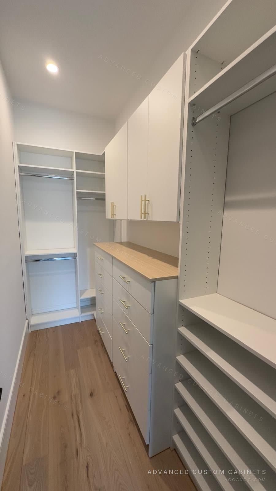 Custom walk-in closet by Advanced Custom Cabinets