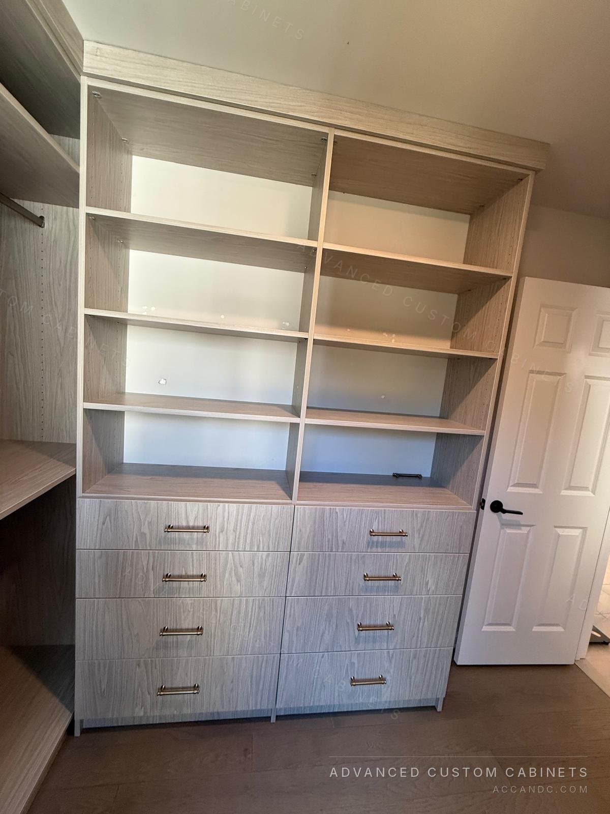 Grey-oak dresser wall with nine drawers, brass pulls and open shelving above